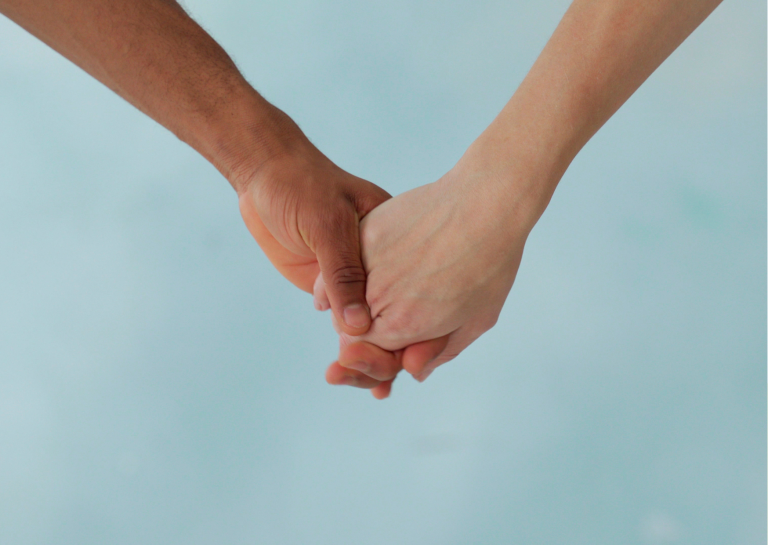 Couple holding hands